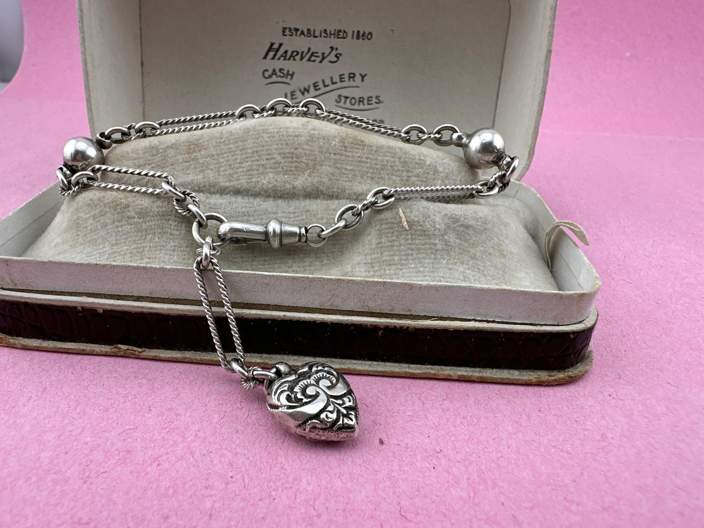 Antique Sterling Silver twist trombone and ball link bracelet with heart charm.