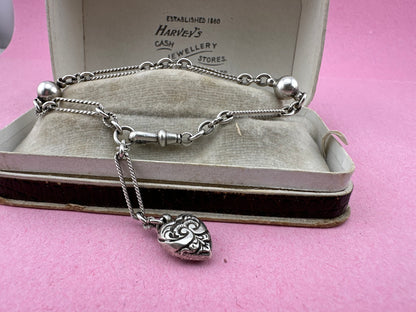 Antique Sterling Silver twist trombone and ball link bracelet with heart charm.