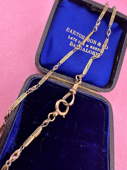 Antique 9ct bi-colour bar and lovers knot Albert chain with floating t-bar, dog clip and bolt clasp