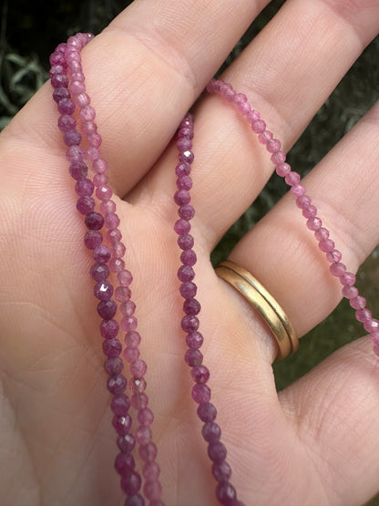 Ruby & Pink tourmaline half and half mini beads with antique 9ct gold bolt clasp and central bead.