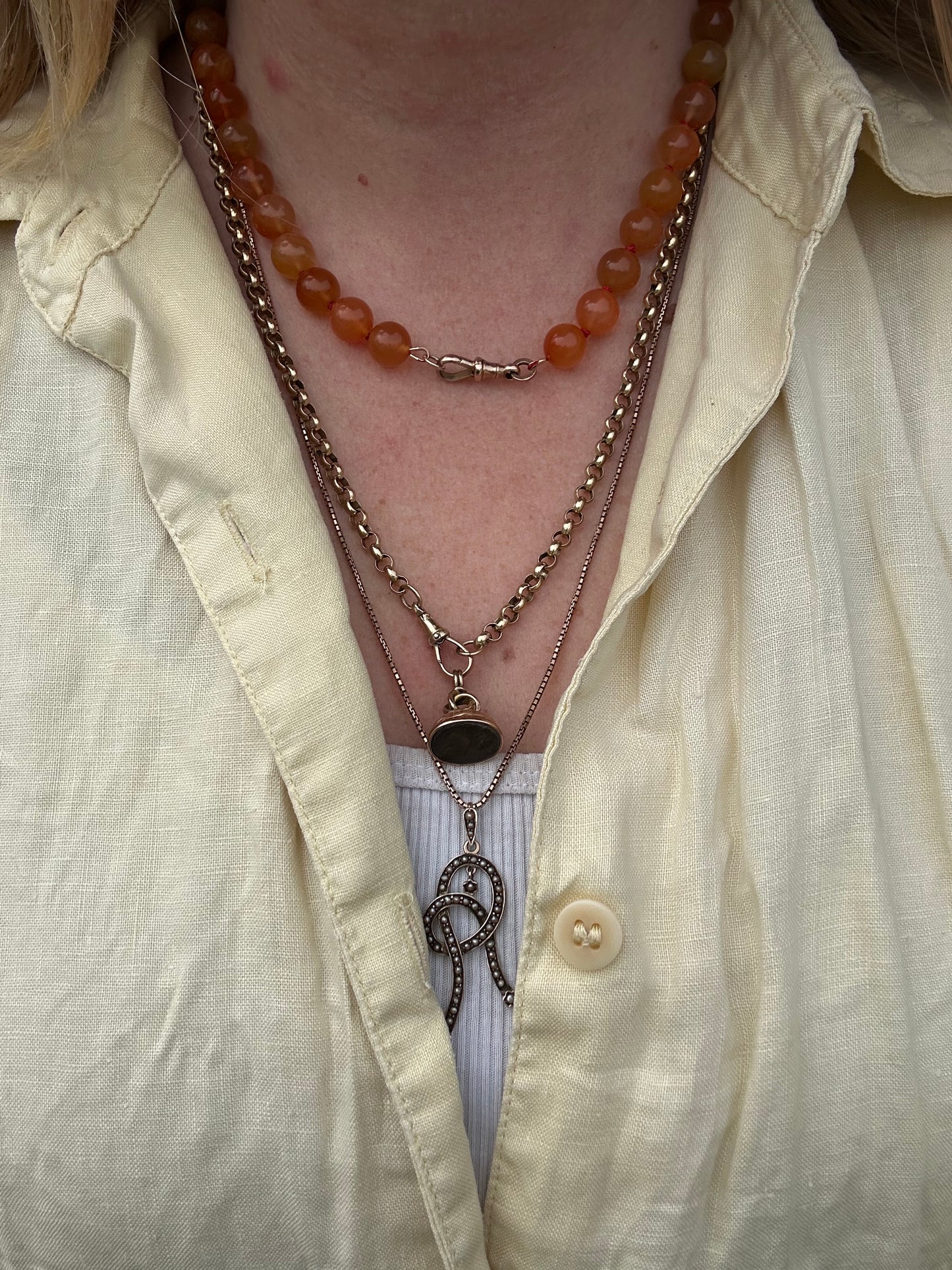 Re-imagined Orange Agate beads with Antique Dog clip