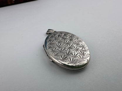 Sterling Silver Star patterned oval locket