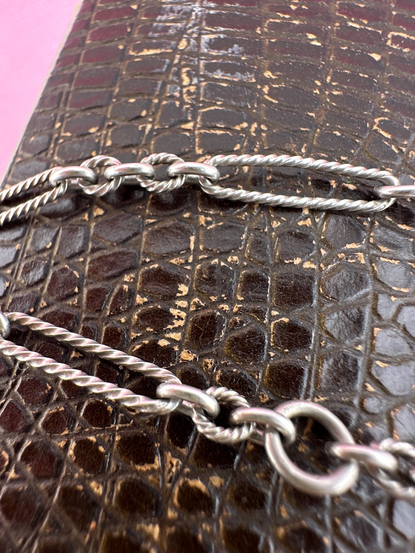 Antique Sterling Silver twist trombone and ball link bracelet with heart charm.
