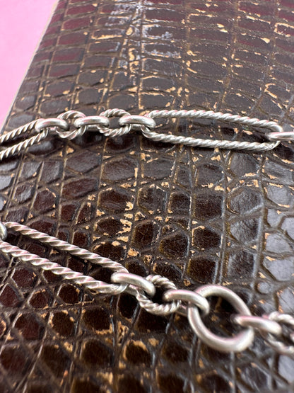 Antique Sterling Silver twist trombone and ball link bracelet with heart charm.