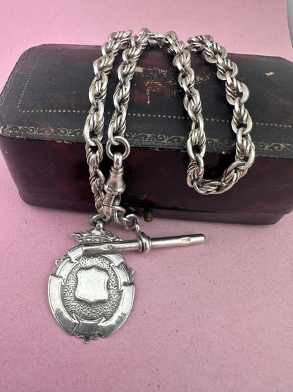 Sterling Silver Lovers Knot Albert chain, with T-bar, dogclip and shield fob.
