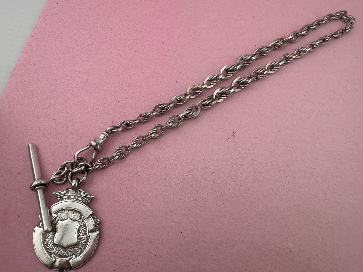 Sterling Silver Lovers Knot Albert chain, with T-bar, dogclip and shield fob.