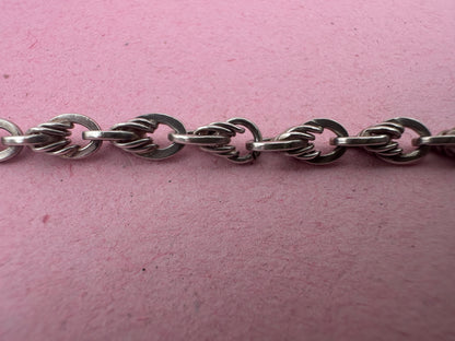 Sterling Silver Lovers Knot Albert chain, with T-bar, dogclip and shield fob.
