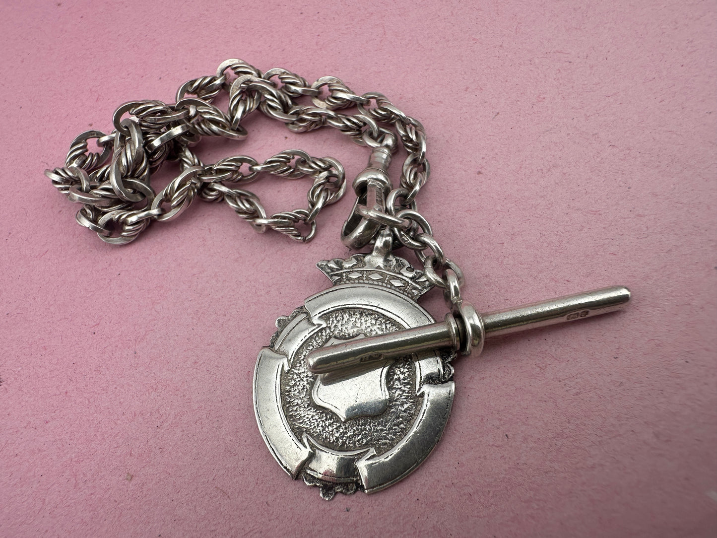 Sterling Silver Lovers Knot Albert chain, with T-bar, dogclip and shield fob.
