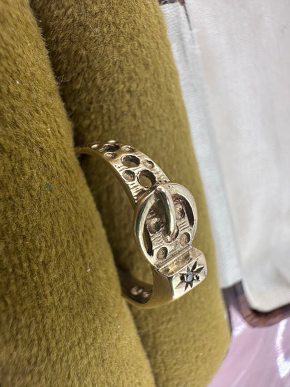 Vintage 9ct Gold Buckle ring with a star set accent diamond.