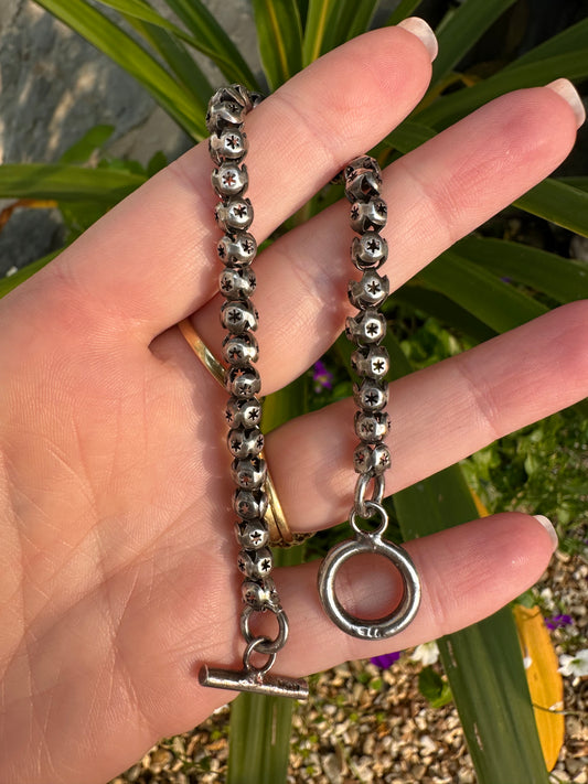 Sterling Silver Star Pierced Ball link bracelet with toggle clasp