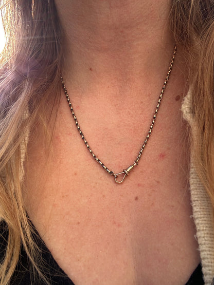 Antique 9ct Peachy gold faceted Oval Belcher with dogclip