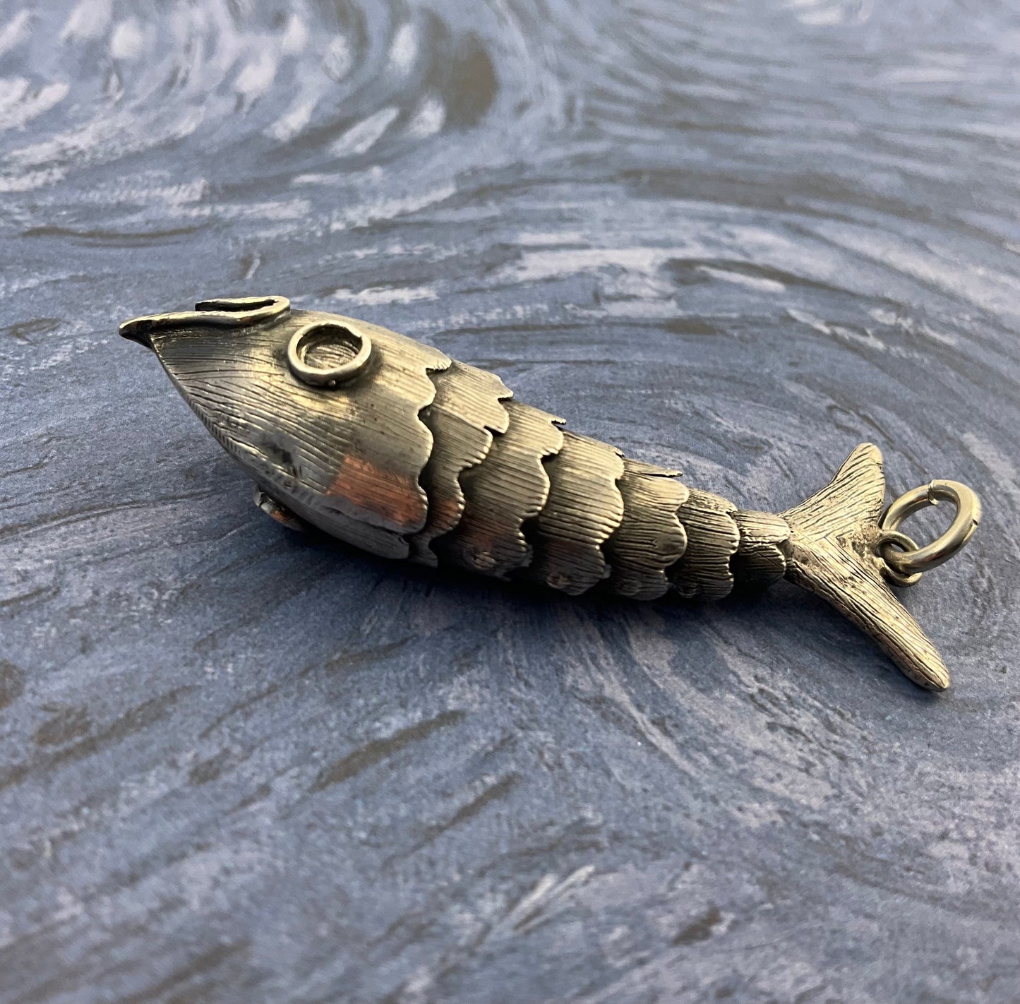 Silver articulated fish charm