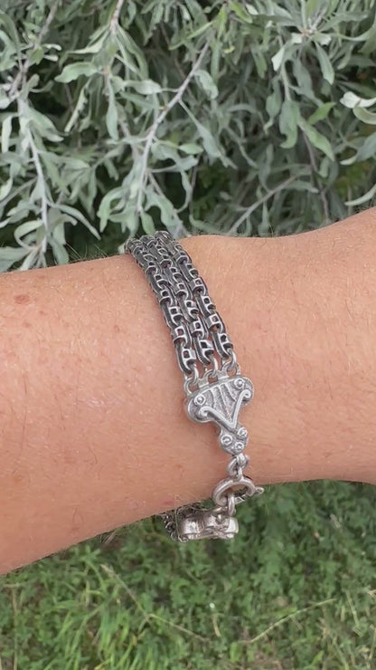 Antique Sterling Silver triple stranded fancy mariner with ornate finials bracelet.