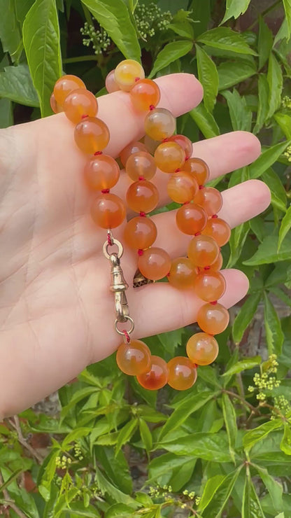 Re-imagined Orange Agate beads with Antique Dog clip