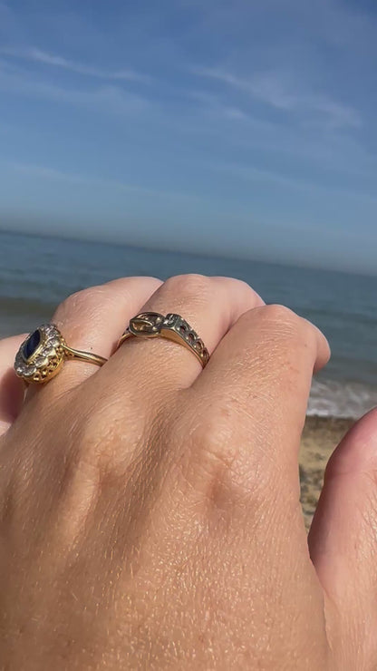 Vintage 9ct Gold Buckle ring with a star set accent diamond.