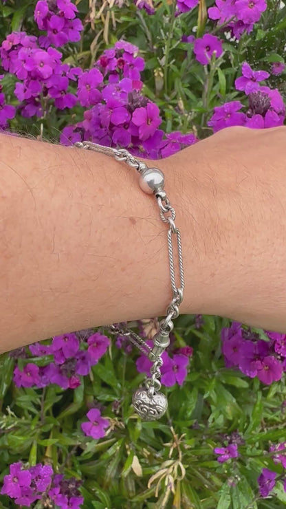 Antique Sterling Silver twist trombone and ball link bracelet with heart charm.