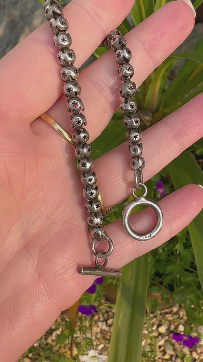 Sterling Silver Star Pierced Ball link bracelet with toggle clasp